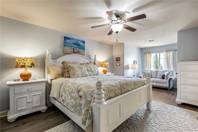 bedroom with ceiling fan, dark wood-style flooring, and visible vents