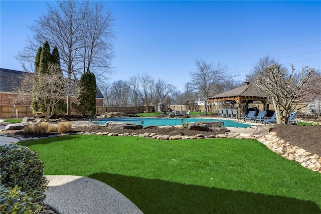 view of yard featuring a fenced in pool, fence, a gazebo, and a patio