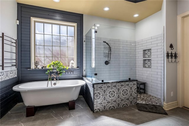 bathroom featuring a freestanding tub, marble finish floor, walk in shower, and recessed lighting