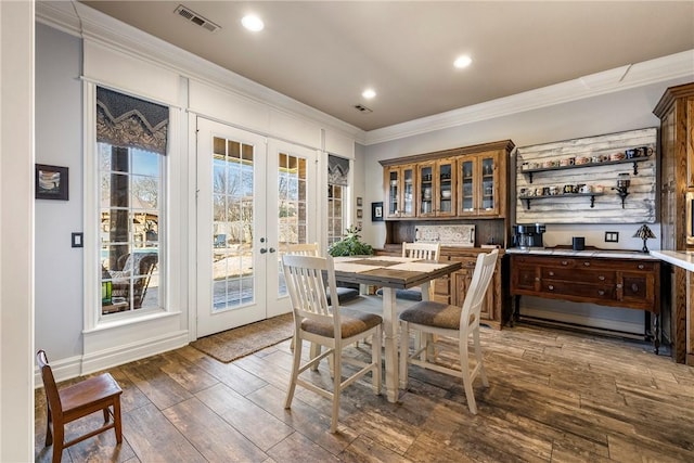 dining room featuring recessed lighting, dark wood-type flooring, visible vents, french doors, and crown molding