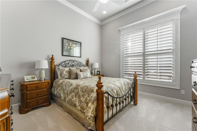 bedroom with light carpet, ceiling fan, ornamental molding, and baseboards