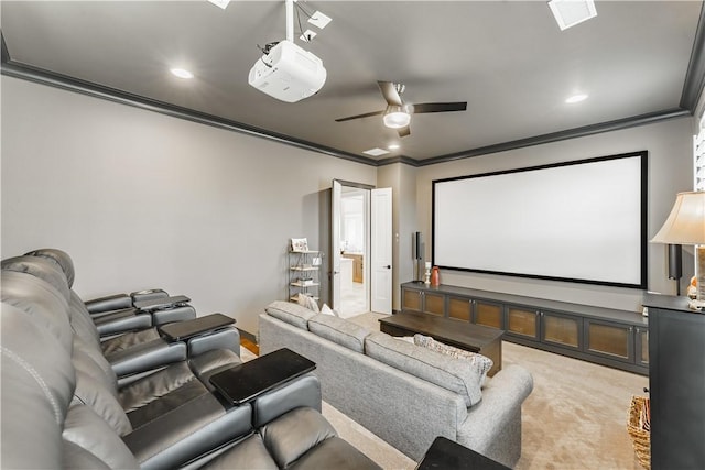 cinema with ornamental molding, recessed lighting, a ceiling fan, and light colored carpet