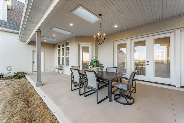 view of patio with french doors and outdoor dining space