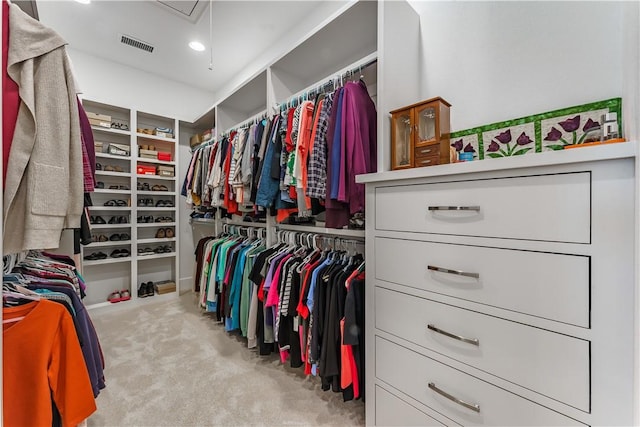 walk in closet featuring carpet flooring and visible vents