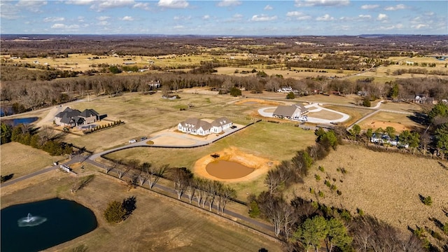 aerial view of property's location featuring rural landscape and a large body of water