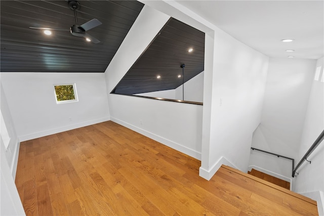 bonus room with a ceiling fan, recessed lighting, baseboards, and wood finished floors