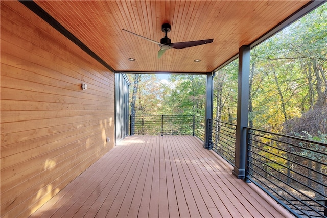 wooden deck with a ceiling fan