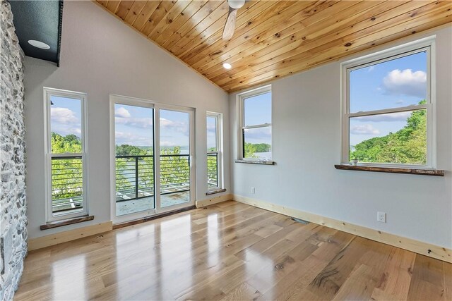 16103 E Ar 12th Hwy, Rogers, AR 72756 - spare room featuring lofted ceiling, healthy amount of natural light, wood finished floors, wood ceiling, and baseboards