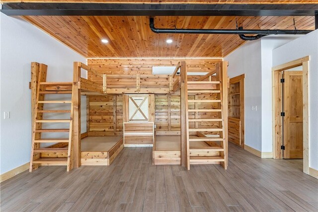 16103 E Ar 12th Hwy, Rogers, AR 72756 - unfurnished bedroom featuring wood ceiling, wood finished floors, baseboards, and recessed lighting