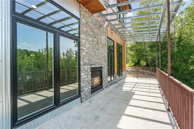 16103 E Ar 12th Hwy, Rogers, AR 72756 - view of patio featuring a pergola and an outdoor stone fireplace