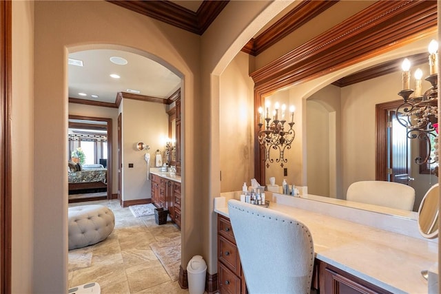 ensuite bathroom featuring crown molding, recessed lighting, vanity, ensuite bath, and baseboards