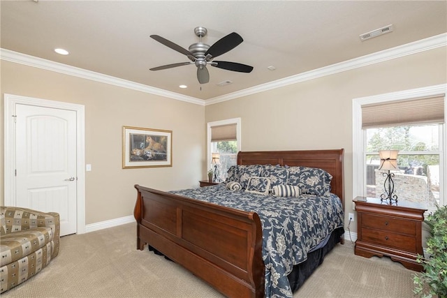 carpeted bedroom featuring ceiling fan, recessed lighting, visible vents, baseboards, and crown molding