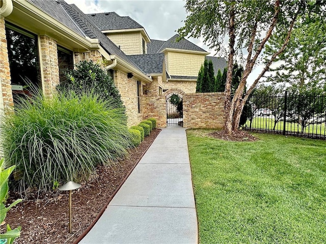 view of yard featuring a gate and fence