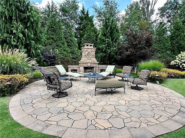 view of patio with an outdoor stone fireplace