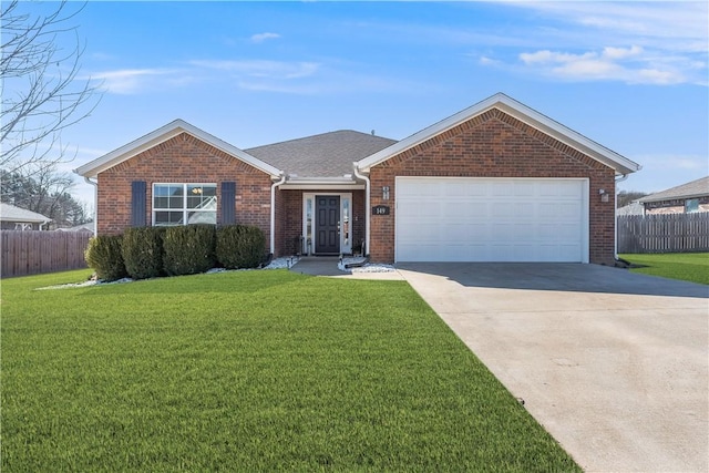 ranch-style house featuring a front yard, brick siding, and fence