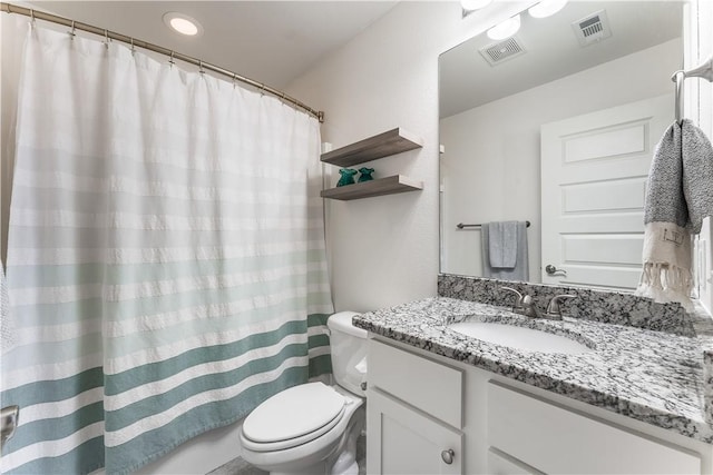 bathroom featuring toilet, curtained shower, visible vents, and vanity