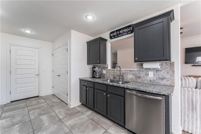 kitchen with decorative backsplash, dishwasher, light stone counters, and a sink