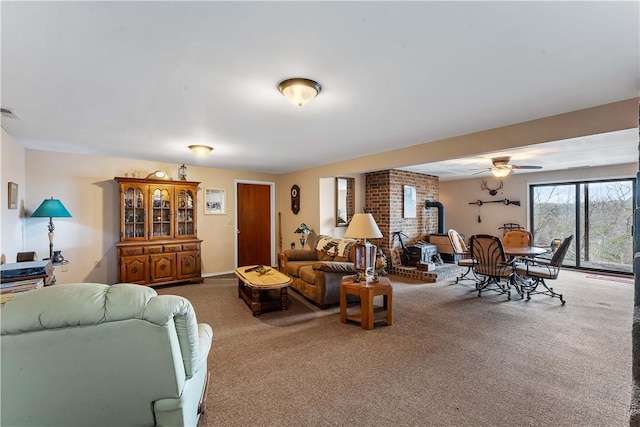 carpeted living room featuring a wood stove