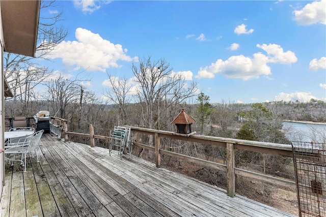 wooden terrace with a water view