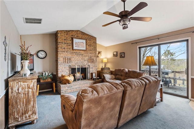 20564 Dogwood Rd, Rogers, AR 72756 - carpeted living room featuring lofted ceiling, ceiling fan, a fireplace, and baseboards