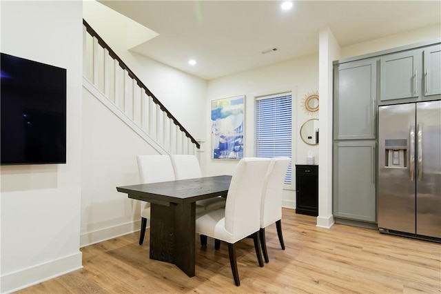 dining area with visible vents, baseboards, stairs, light wood-type flooring, and recessed lighting