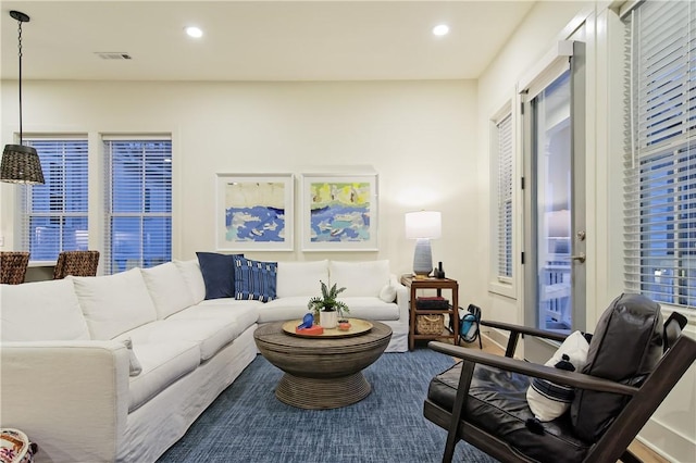 living room with recessed lighting and visible vents