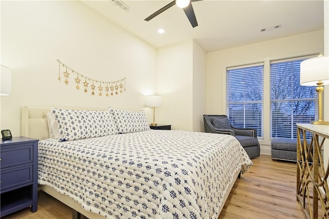 bedroom with recessed lighting, visible vents, ceiling fan, and light wood finished floors