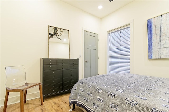 bedroom with wood finished floors and recessed lighting