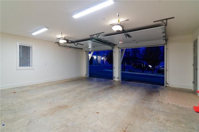 garage with baseboards and a garage door opener