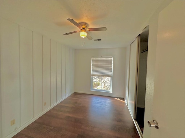 unfurnished bedroom featuring a ceiling fan and wood finished floors