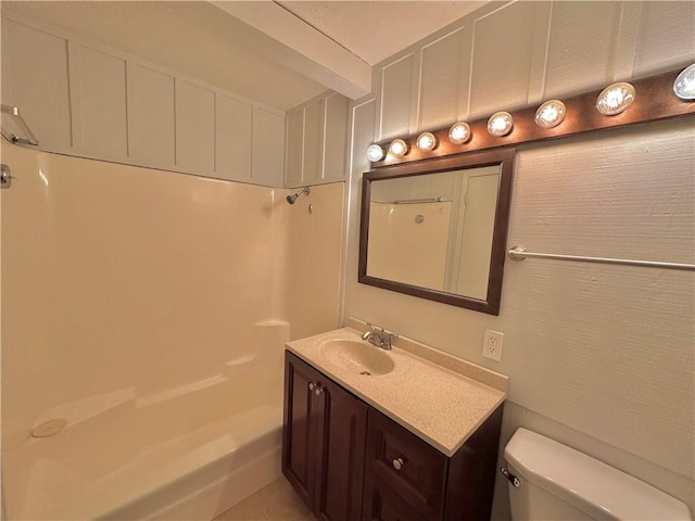 bathroom with vanity, walk in shower, and toilet