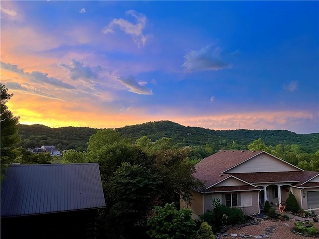 view of mountain feature featuring a view of trees