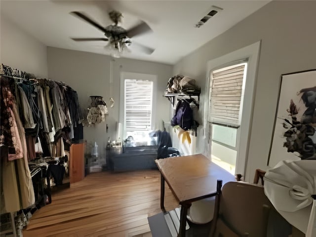 mudroom featuring ceiling fan, wood-type flooring, and visible vents