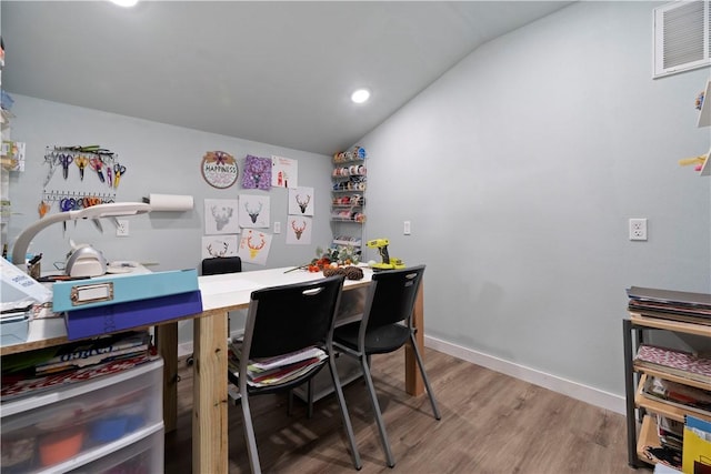 office space with lofted ceiling, recessed lighting, wood finished floors, visible vents, and baseboards