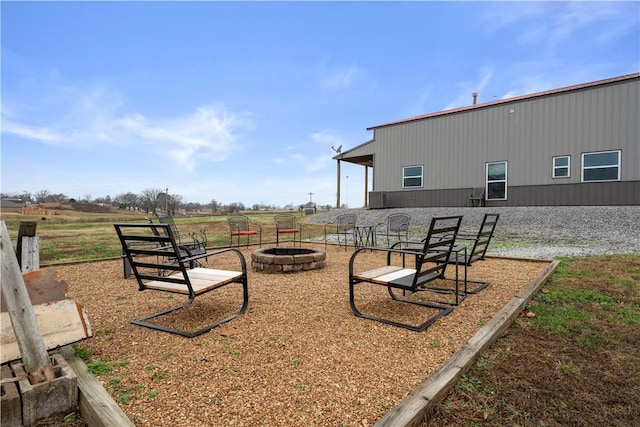 view of yard featuring an outdoor fire pit