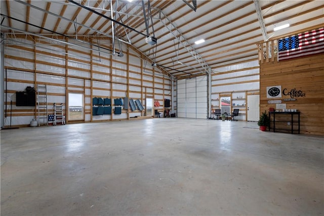 garage featuring metal wall and a garage door opener