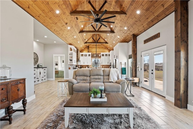 living room featuring high vaulted ceiling, french doors, wooden ceiling, and light wood finished floors