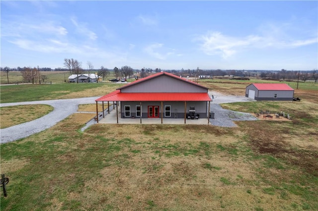 exterior space with a rural view and an outdoor structure