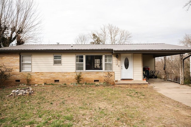 ranch-style home featuring crawl space, metal roof, an attached carport, and concrete driveway