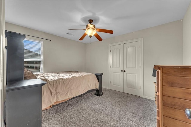 115 NE Lake Forest Ln, Bentonville, AR 72712 - bedroom with carpet, a closet, visible vents, ceiling fan, and baseboards