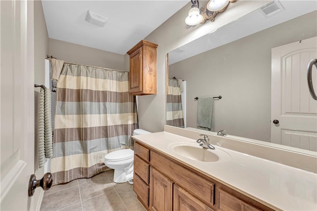 115 NE Lake Forest Ln, Bentonville, AR 72712 - full bathroom featuring toilet, vanity, visible vents, and tile patterned floors
