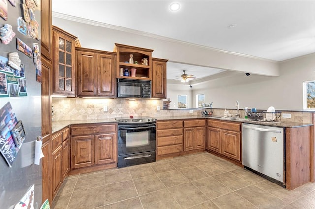 115 NE Lake Forest Ln, Bentonville, AR 72712 - kitchen featuring a peninsula, black appliances, tasteful backsplash, brown cabinetry, and crown molding