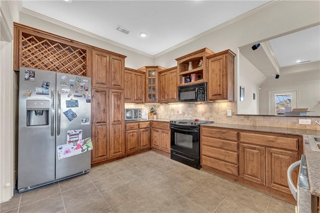 115 NE Lake Forest Ln, Bentonville, AR 72712 - kitchen featuring black appliances, visible vents, and brown cabinetry