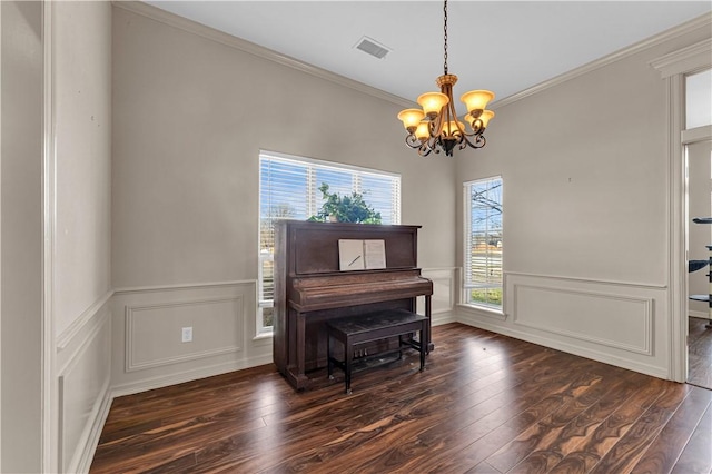115 NE Lake Forest Ln, Bentonville, AR 72712 - sitting room featuring dark wood-style floors, visible vents, ornamental molding, and an inviting chandelier