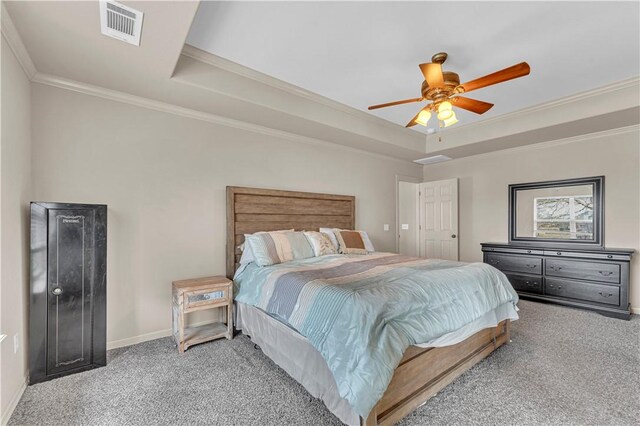 115 NE Lake Forest Ln, Bentonville, AR 72712 - carpeted bedroom featuring ceiling fan, visible vents, baseboards, ornamental molding, and a tray ceiling
