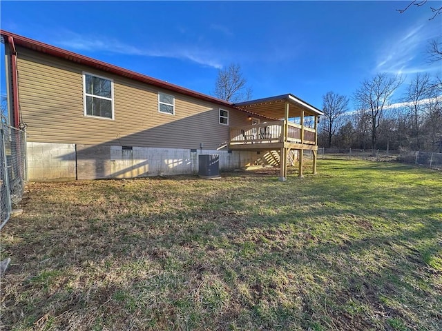 rear view of property featuring central AC unit, a yard, stairs, fence, and a wooden deck