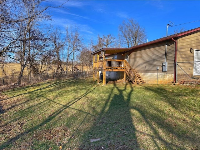 view of yard with stairway, fence, and a wooden deck