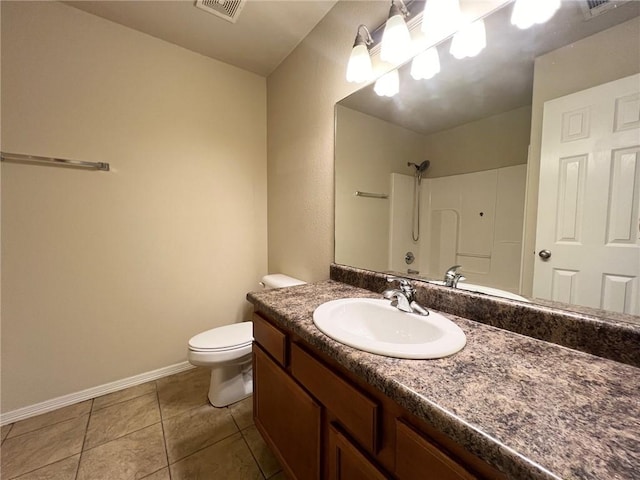 bathroom featuring visible vents, toilet, tile patterned floors, walk in shower, and vanity