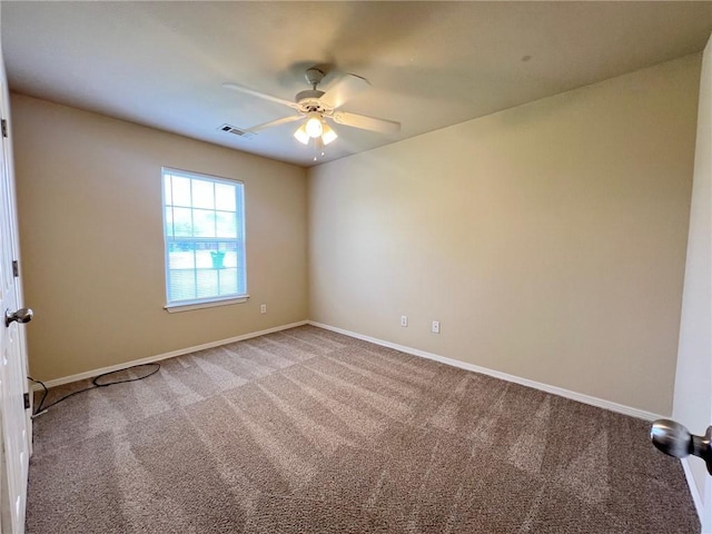 unfurnished room featuring a ceiling fan, baseboards, visible vents, and carpet flooring