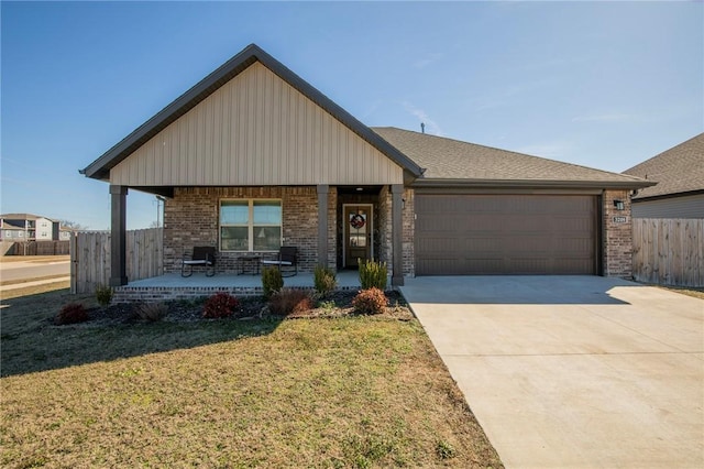 view of front of home featuring concrete driveway, brick siding, fence, and an attached garage